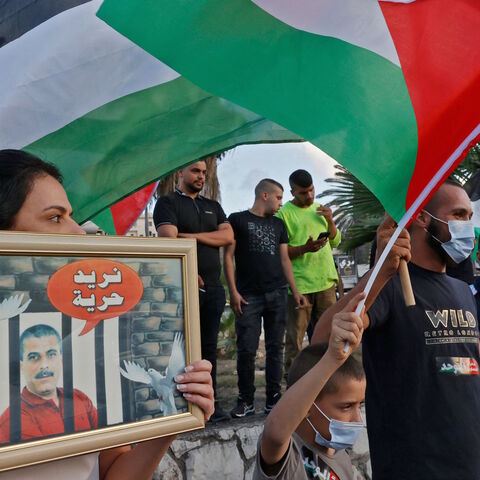 Arab Israeli protesters demonstrate in the mostly Arab city of Umm al-Fahm in northern Israel, on Sept. 10, 2021, to denounce punitive measures taken by the Israel Prison Service against Palestinian prisoners, after six of them escaped from the northern Gilboa prison. 