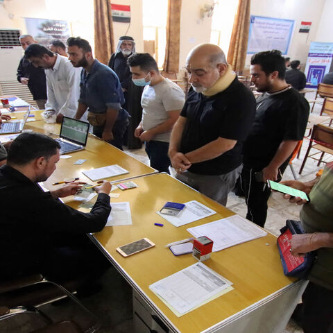 Iraqis register to obtain their voting cards ahead of the upcoming parliamentary elections, Najaf, Iraq, Sept. 29, 2021.