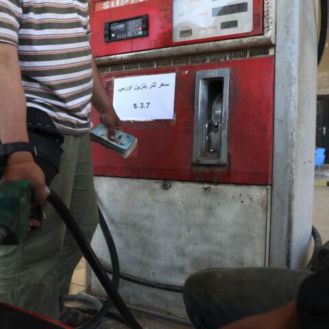 Gasoline prices are displayed in Turkish lira at a gas station in the town of Sarmada in Syria's northwestern Idlib province, on June 15, 2020. 