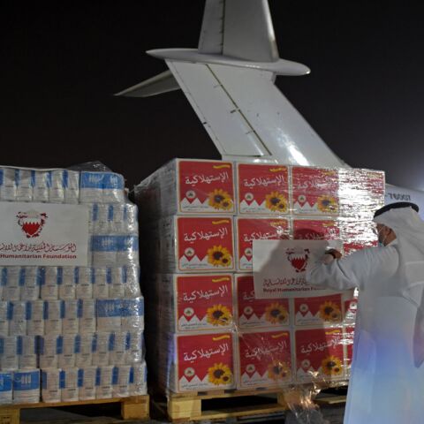 Volunteers label a shipment of humanitarian aid to be sent to Afghanistan at Bahrain International Airport on Muharraq Island, near the capital, Manama, on Sept. 4, 2021.