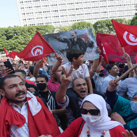 Tunisians chant slogans supporting President Kais Saied during a rally at Habib Bourguiba Avenue, Tunis, Tunisia, Oct. 3, 2021.