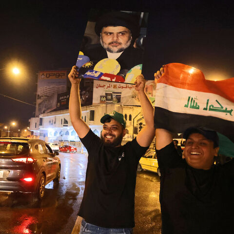 Supporters of Iraqi Shiite cleric Moqtada al-Sadr celebrate in Baghdad's Tahrir square on Oct. 11, 2021 following the announcement of parliamentary elections' results.
