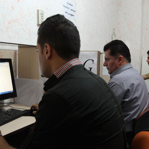 Iranians use internet at a cybercafe in the center of the Iranian capital Tehran on May 14, 2013.