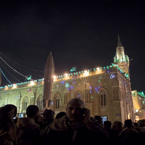Muslims attend a ritual ceremony to commemorate the Mawlid of Imam Hussein, grandson of the Prophet Muhammad, outside Al-Hussein Mosque, Cairo, Egypt, Jan. 16, 2018.