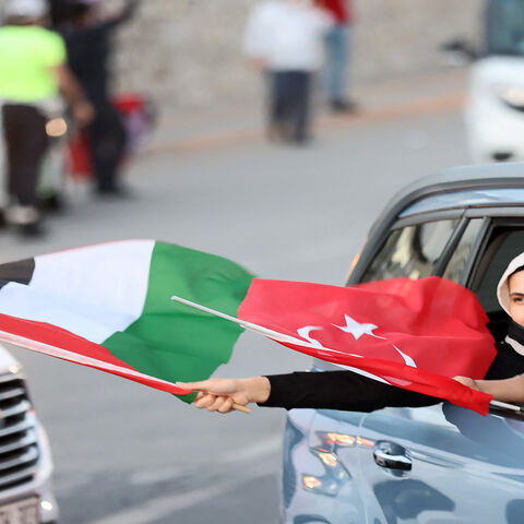 A pro-Palestinian supporter holds a Palestinian flag during a protest to condemn the ongoing Israeli airstrikes on the Gaza Strip, in Ankara, Turkey, May 18, 2021.