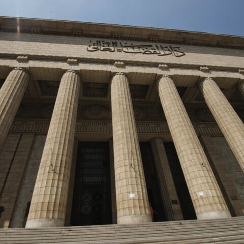 People walk in and out of the Cairo High Court in Egypt on Aug. 25, 2013.