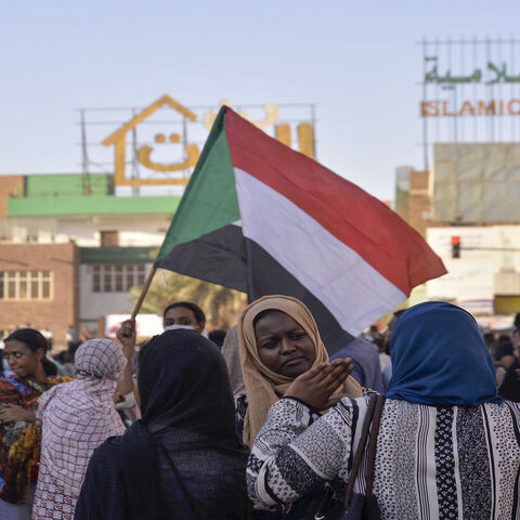 Sudanese women chat during a rally in 60th Street following a deal-signing ceremony to restore the transition to civilian rule in the country, Khartoum, Sudan, Nov. 21, 2021.