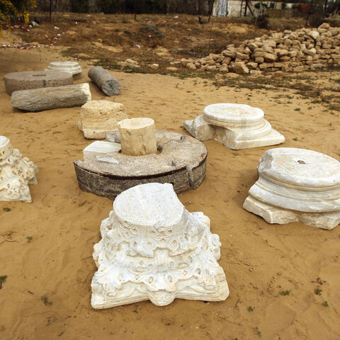 Capitals (L) and two plinths (R) are seen in the sand at the archaeological site of the St. Hilarion Monastery, in Tell Umm al-Amr, central Gaza Strip, March 19, 2013.
