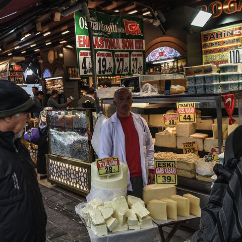 Vendors sell cheese as people shop near the New Mosque area in Istanbul's Eminonu district on Nov. 6, 2018. 