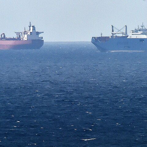 A picture taken May 9, 2019, from northern port of Le Havre, shows a Saudi cargo ship next to a British crude oil tanker in the port of Le Havre.