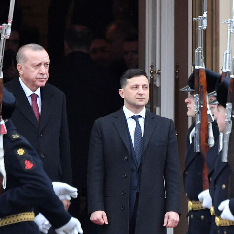 Ukrainian President Volodymyr Zelensky and his Turkish counterpart Recep Tayyip Erdogan watch honour guards passing by during a welcoming ceremony prior to their talks in Kiev on Feb. 3, 2020. 