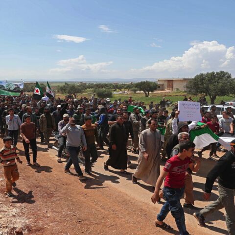 Syrian demonstrators gather during a protest in Syria's Idlib province on May 1, 2020, to protest a reported attack by Hayat Tahrir al-Sham.