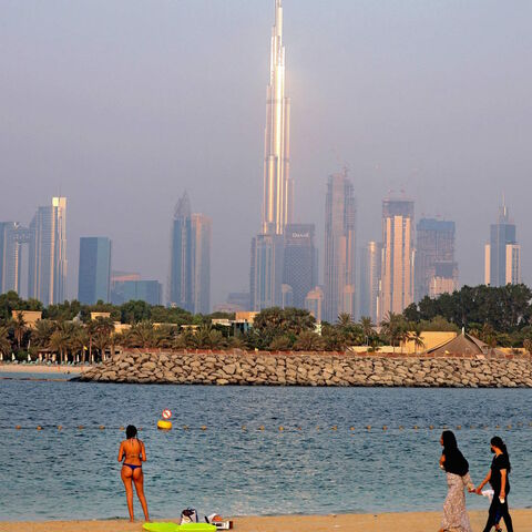 Emirati women look at a tourist in Dubai's Jumeirah Beach Residence on Aug. 17, 2021.