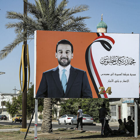This picture taken on Sept. 26, 2021 shows an electoral campaign billboard ahead of Iraq's early legislative elections, depicting current parliament speaker Mohamed al-Halbousi, along the side of a road in the city of Ramadi, the capital of Iraq's central Anbar Governorate.