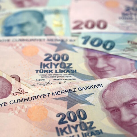 A picture taken on Dec. 7, 2021 in Istanbul shows Turkish lira banknotes. 