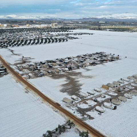 An aerial picture shows a camp for internally displaced people covered in snow, Azaz, in the rebel-controlled northern countryside of Aleppo province near the border with Turkey, Syria, Jan. 19, 2022.