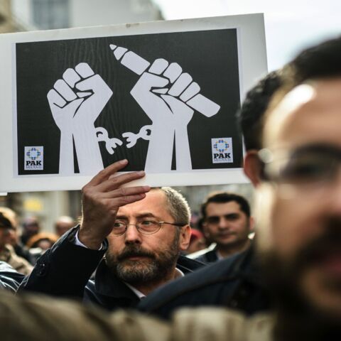 Journalists hold placards on Jan. 10, 2016, during a march on Journalism Day on Istiklal Ave. in Istanbul, as they protest the imprisonment of journalists.