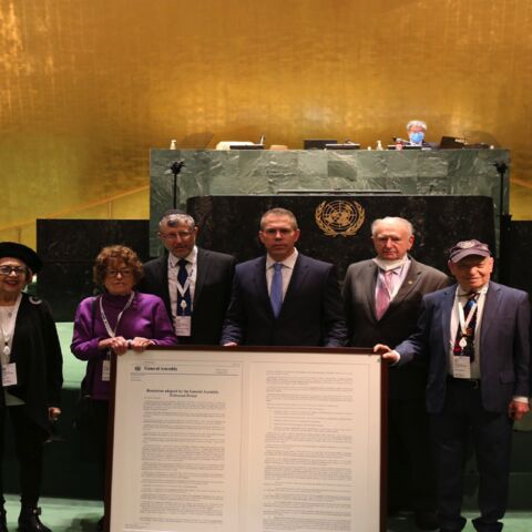 Israel's UN Envoy Gilad Erdan together with Holocaust survivors, after the UN General Assembly adopted an Israel-sponsored resolution against Holocaust denial, New York, Jan. 20, 2022.