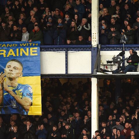 A Ukraine solidarity banner is hung from the stands at English club Everton's Goodison Park ground for its Premier League fixture against Manchester City on February 26