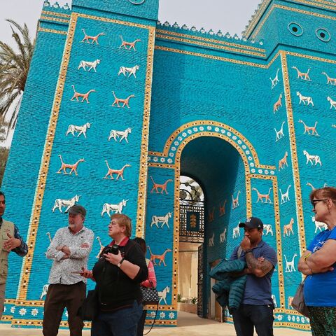 Foreign tourists visit the Ishtar Gate in the  ancient city of Babylon, some 100 km south of the Iraqi capital Baghdad