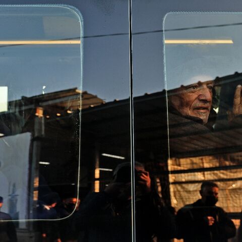 Palestinian workers in a minivan as they leave Beit Hanun in the northern Gaza Strip for the Erez crossing into Israel