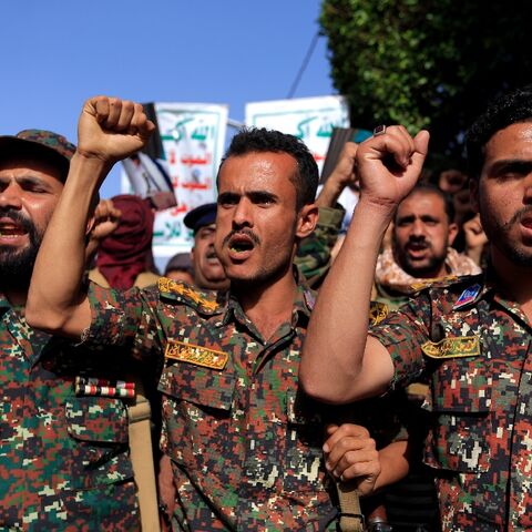 Soldiers loyal to Yemen's Huthi rebels join a rally in the rebel-held capital Sanaa marking the seventh anniversary of a Saudi-led coalition's military intervention in the country's devastating civil war