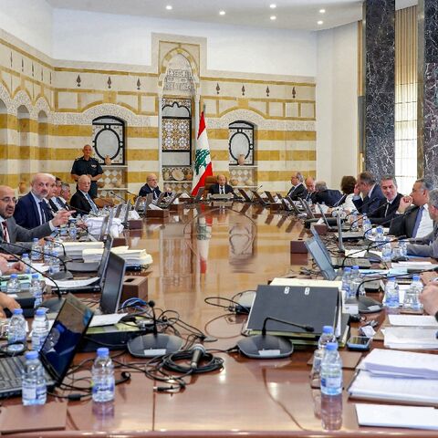 Lebanon's President Michel Aoun (C-R) and Prime Minister Najib Mikati (C-L) headed the outgoing government's final cabinet meeting at the governmental palace in the capital Beirut