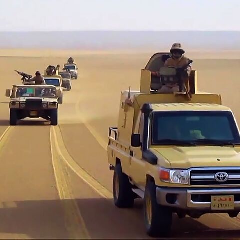 An image grab taken from a handout video released by the official Facebook page of Egypt's Military Spokesman on December 8, 2020 shows an Egyptian army trucks in the desert