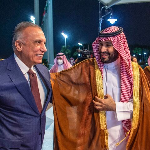 Saudi Crown Prince Mohammed bin Salman (R) receives Iraqi Prime Minister Mustafa al-Kadhemi at the airport in the Red Sea city of Jeddah