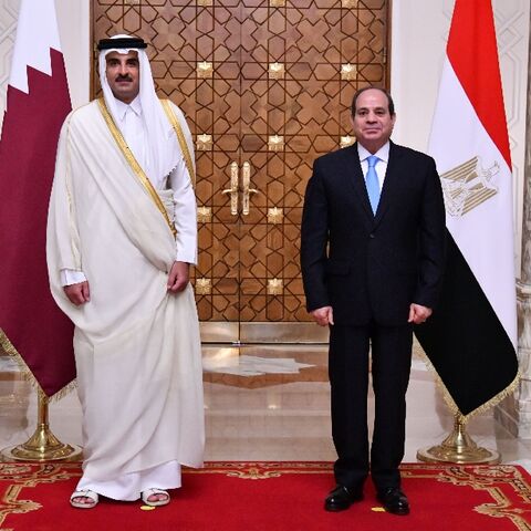 Egyptian President Abdel Fattah al-Sisi (R) receives the Emir of Qatar Sheikh Tamim bin Hamad Al-Thani at the presidential palace in the capital Cairo