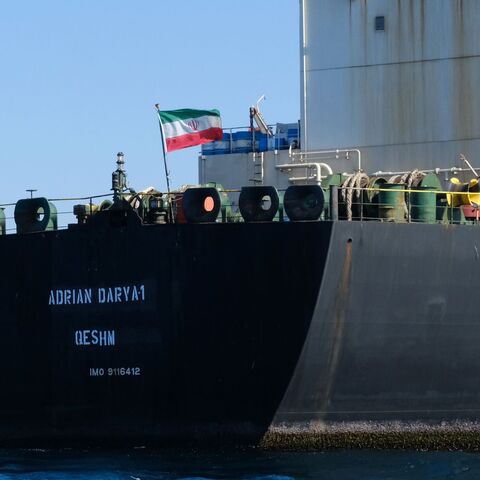 TOPSHOT - An Iranian flag flutters on board the Adrian Darya oil tanker, formerly known as Grace 1, off the coast of Gibraltar on August 18, 2019. - Gibraltar rejected a US demand to seize the Iranian oil tanker at the centre of a diplomatic dispute as it prepared to leave the British overseas territory after weeks of detention. (Photo by Johnny BUGEJA / AFP) (Photo by JOHNNY BUGEJA/AFP via Getty Images)