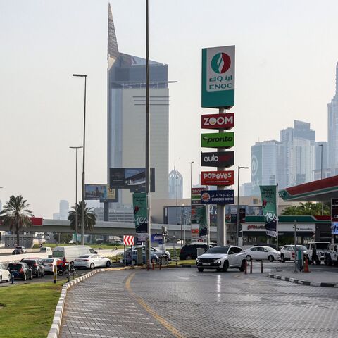 Vehicles queue to refuel at a petrol station in Dubai on June 30, 2022. (Photo by Giuseppe CACACE / AFP) (Photo by GIUSEPPE CACACE/AFP via Getty Images)