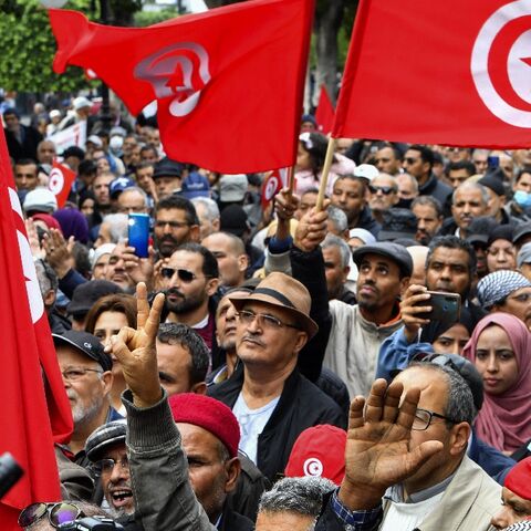 Tunisian demonstrators take part in a rally against President Kais Saied in the capital Tunis