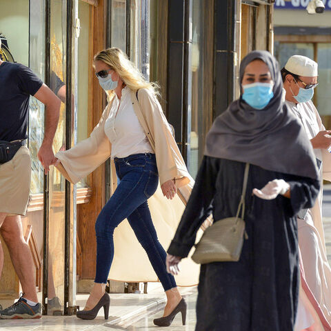 Shoppers walk past jewellery shops in the Taiba gold market in the capital Riyadh on June 29, 2020, after authorities announced a 10% increase in the VAT rate, to reach 15%, starting from first of July. (Photo by FAYEZ NURELDINE / AFP) (Photo by FAYEZ NURELDINE/AFP via Getty Images)