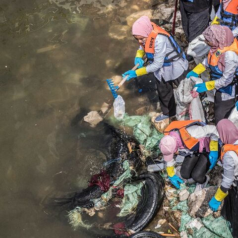 Volunteers collect garbage from the Nile in Egypt's capital Cairo in a clean-up campaign, on March 7, 2020