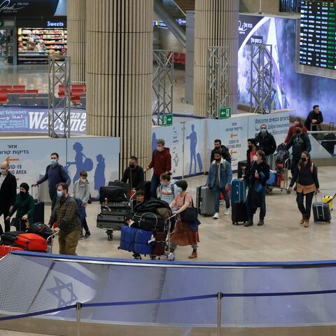 Passengers arrive at Israel's Ben Gurion airport in Lod on March 1, 2022. A US visa waiver will energize travel between the two countries. (Photo by JACK GUEZ/AFP via Getty Images)