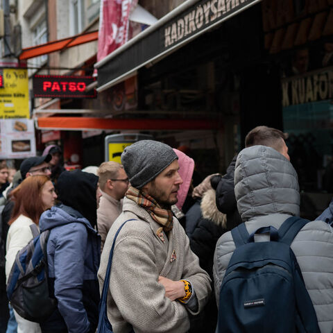Russian physics researcher Yuriy waits in line for tickets to see Russian rapper Oxxxymiron on Kadikoy Street, Istanbul, Turkey, March 15, 2022.