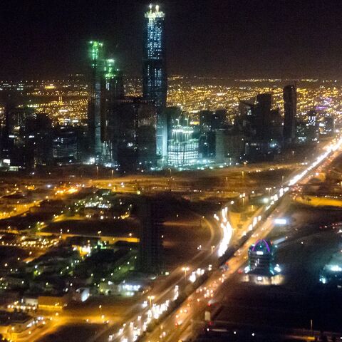 The skyline of Riyadh, Saudi Arabia, March 28, 2014, is seen at night in this aerial photograph from a helicopter. AFP PHOTO / Saul LOEB (Photo credit should read SAUL LOEB/AFP via Getty Images)