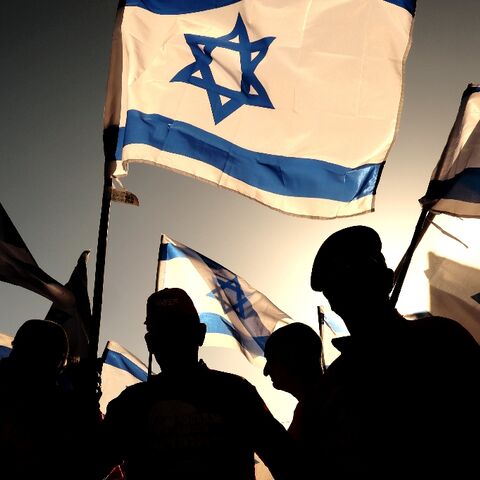 Israeli military veterans join a protest against the government's judicial reforms on a highway north of Tel Aviv