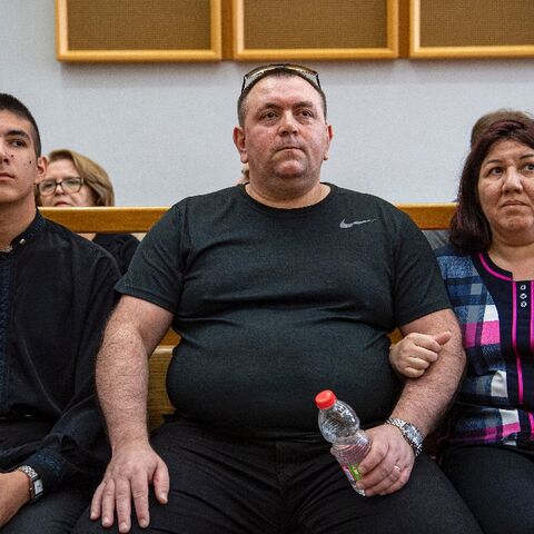Roman Zdorov (C) burst into tears when the court freed him more than 16 years after he was first imprisoned over a schoolgirl's murder