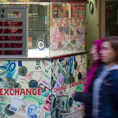 ISTANBUL, TURKEY - DECEMBER 05: People wallk past a currency exchange shop on December 5, 2016 in Istanbul, Turkey. As the Turkish Lira plunged to record lows in past weeks, President Recep Tayyip Erdogan in a speech Saturday said his political enemies were trying to sabotage the economy and urged citizens to convert their foreign currency savings into lira or gold. Borsa Istanbul, Turkey's main stock exchange, became the first institution to act on the presidents call, converting all it's cash assets to li