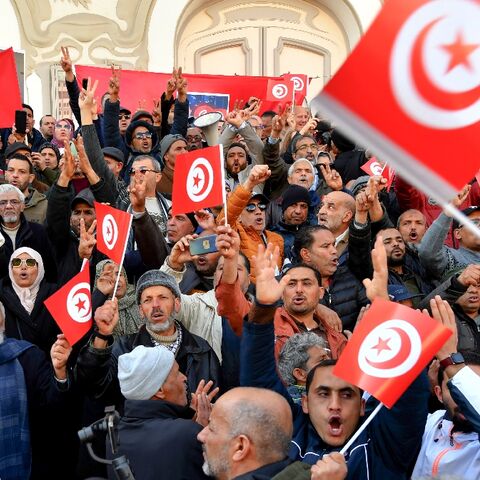 Waving their national flag, Tunisians demonstrate against their president and demand the release of detaines opposed to Kais Saied's rule