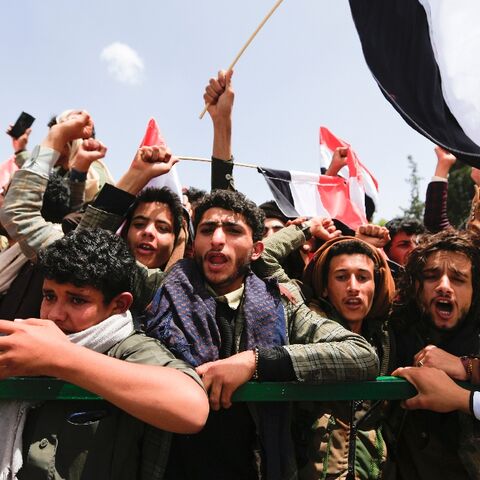 Yemenis await the arrival of freed prisoners at Sanaa airport