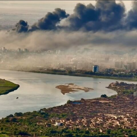 Black smoke covers the sky above the capital Khartoum