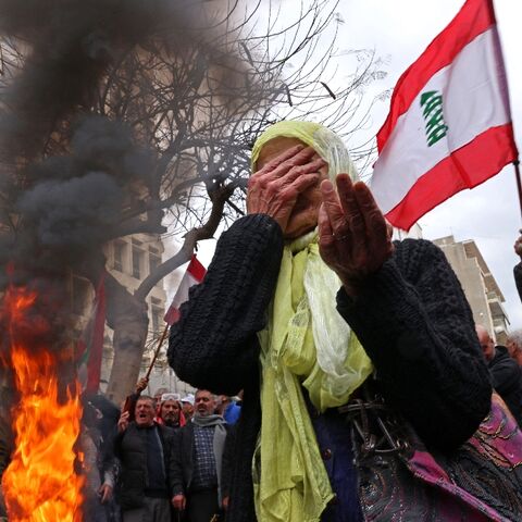 Protesters rally outside Lebanon's central bank headquarters in Beirut on March 30, 2023, demanding pension payments are adjusted to runaway inflation