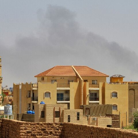 Smoke rises above buildings in Khartoum as fighting between the forces of two rival generals continues
