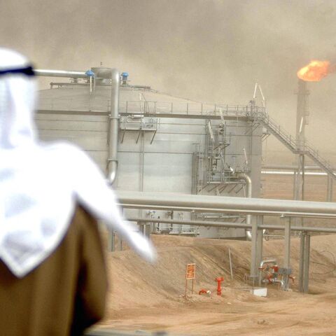 An employee of the Kuwait Oil Company (KOC) looks at 25 January 2005 the Gathering Center No.15 of al-Rawdatain field, 100 kms north of Kuwait City, following its inauguration just three years after coming under explosion. The KOC affiliated center came under fire by the eve of 2002 due to an oil leakage from the main pipe that protrudes from the Center. According to the emergency plan the center was immediately suspended from action. The oil leakage that reached the gas boosting station 130 and neighbourin