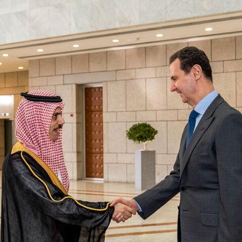 Syria's President Bashar al-Assad (R) received Saudi Arabia's Foreign Minister Faisal bin Farhan in Damascus last month