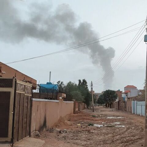 Smoke billows in the distance during ongoing fighting in Khartoum