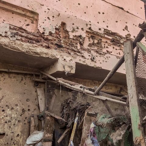A bullet- and shrapnel-riddled wall in south Khartoum's Souk Sitta